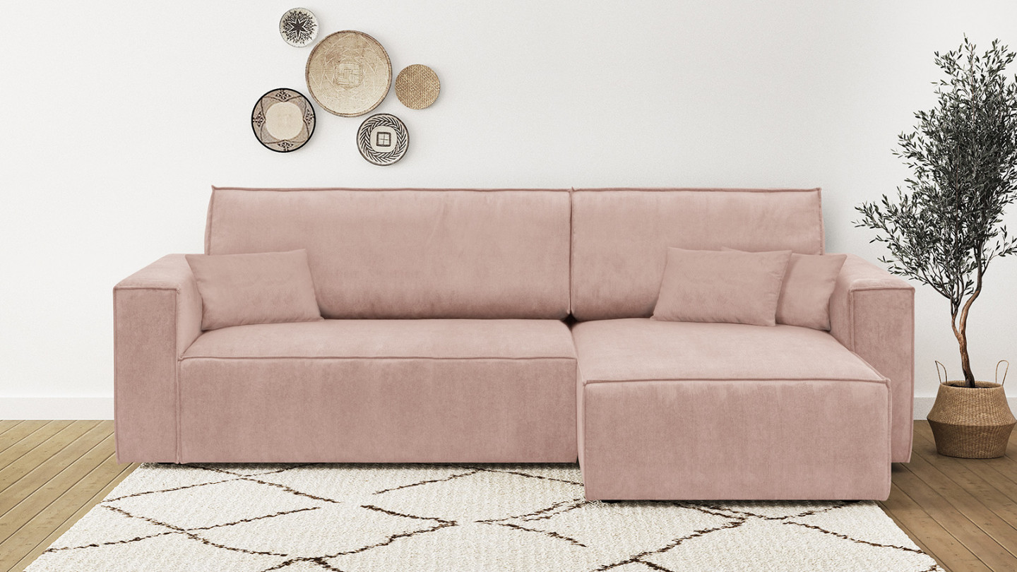 Canapé d'angle convertible réversible 4 places avec coffre de rangement en velours fines côtes rose pâle - Livia New